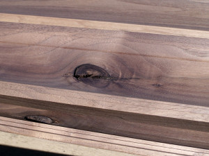 Walnut crown moulding with a knot