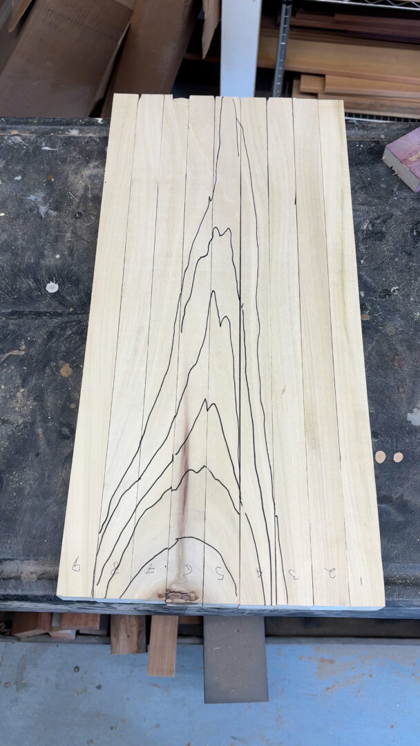 Flat sawn Poplar board with grain pattern traced out in black