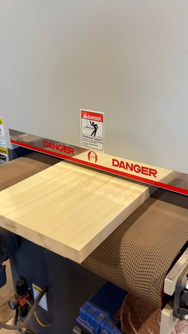 CVG Poplar board running through sander